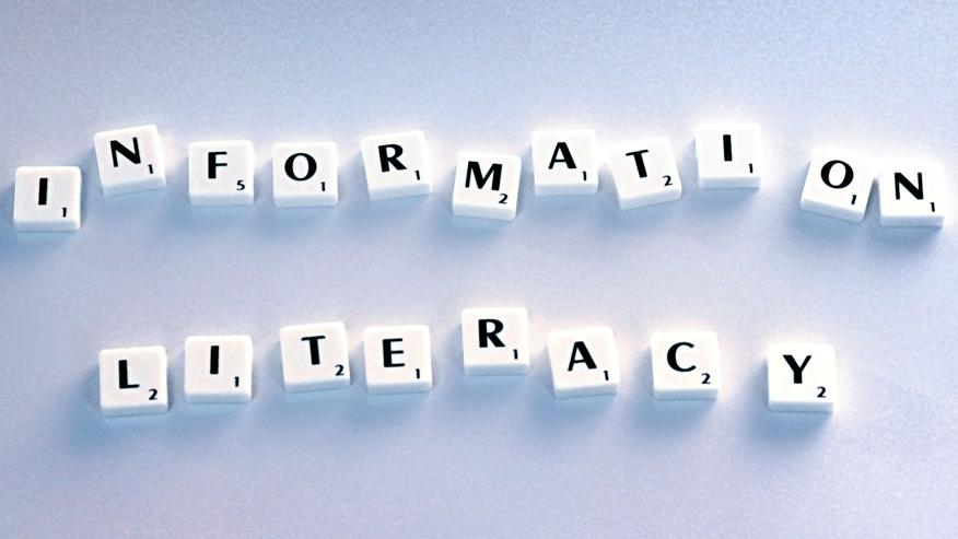 Letter tiles spelling out the words "Information Literacy"
