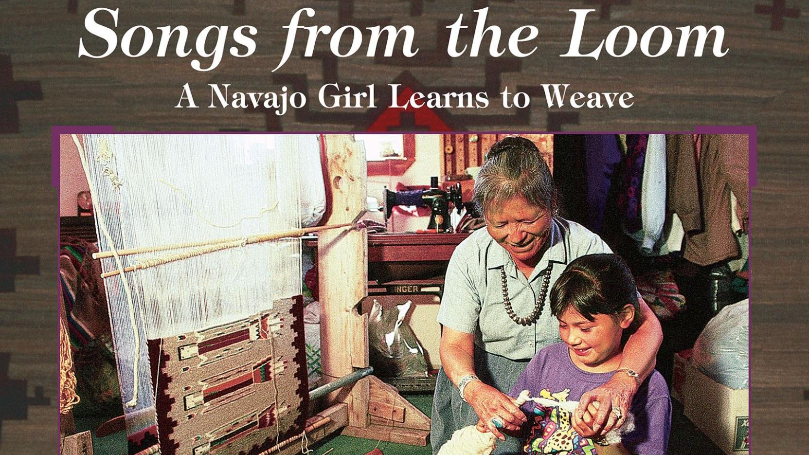 The cover of "Songs from the Loom: A Navajo Girl Learns to Weave," by Monty Roessel. The cover features an image of a child weaving with the help of an older woman.
