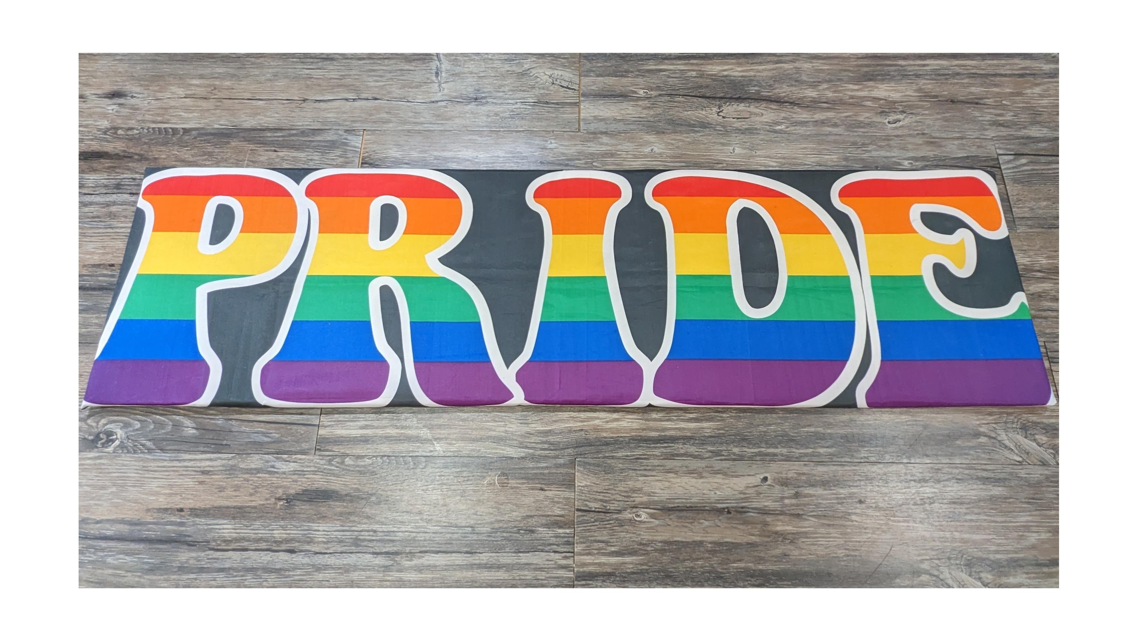 The Word "Pride" with a rainbow overlay.