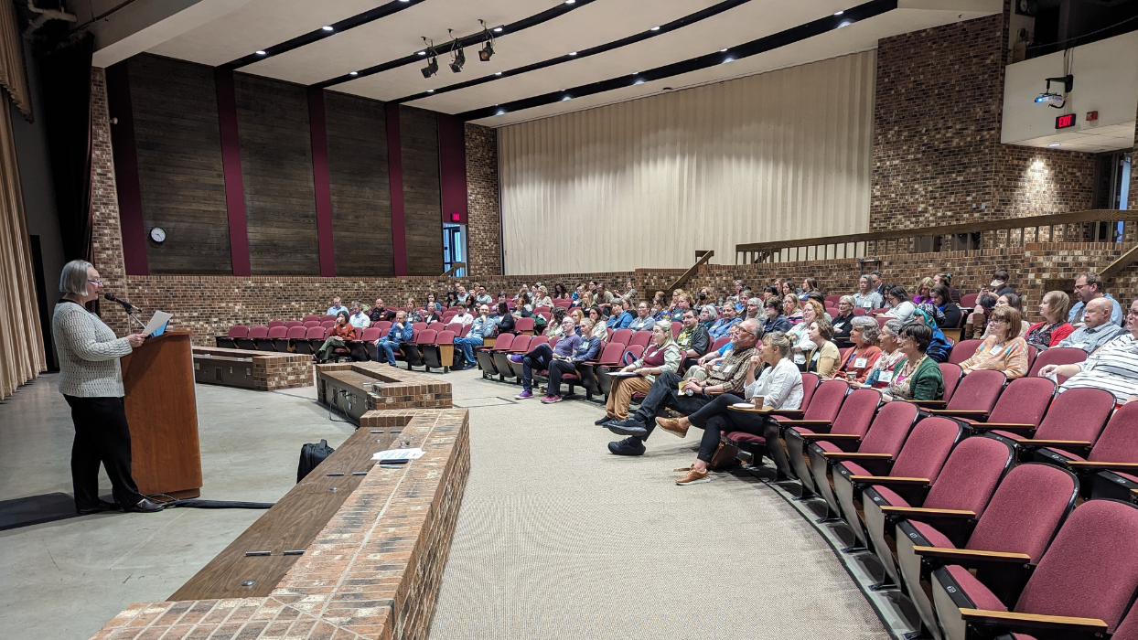 Image of Gerri Moeller speaking at to a group at the 2024 Minitex Connect conference.