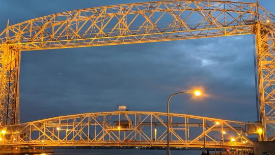 A photograph of the lift bridge in Duluth, Minnesota at dusk.