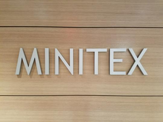 A photograph of the "Minitex" moniker in the vestibule of Minitex's offices in Wilson Library.