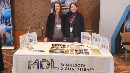 MDL staff at information table for Minnesota Digital Library