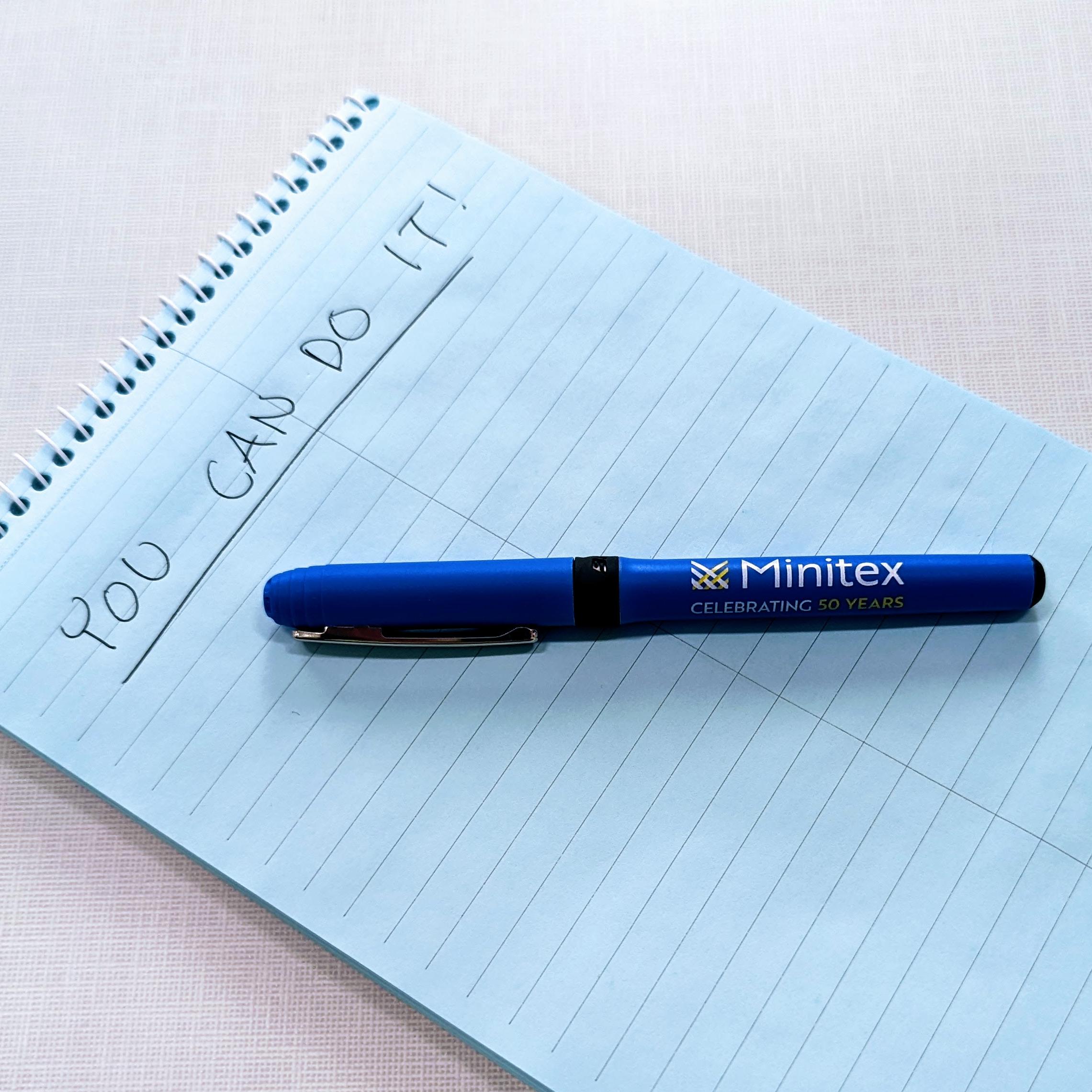 An image of a blue Minitex pen sitting on a notepad with "You can do it!" written at the top.
