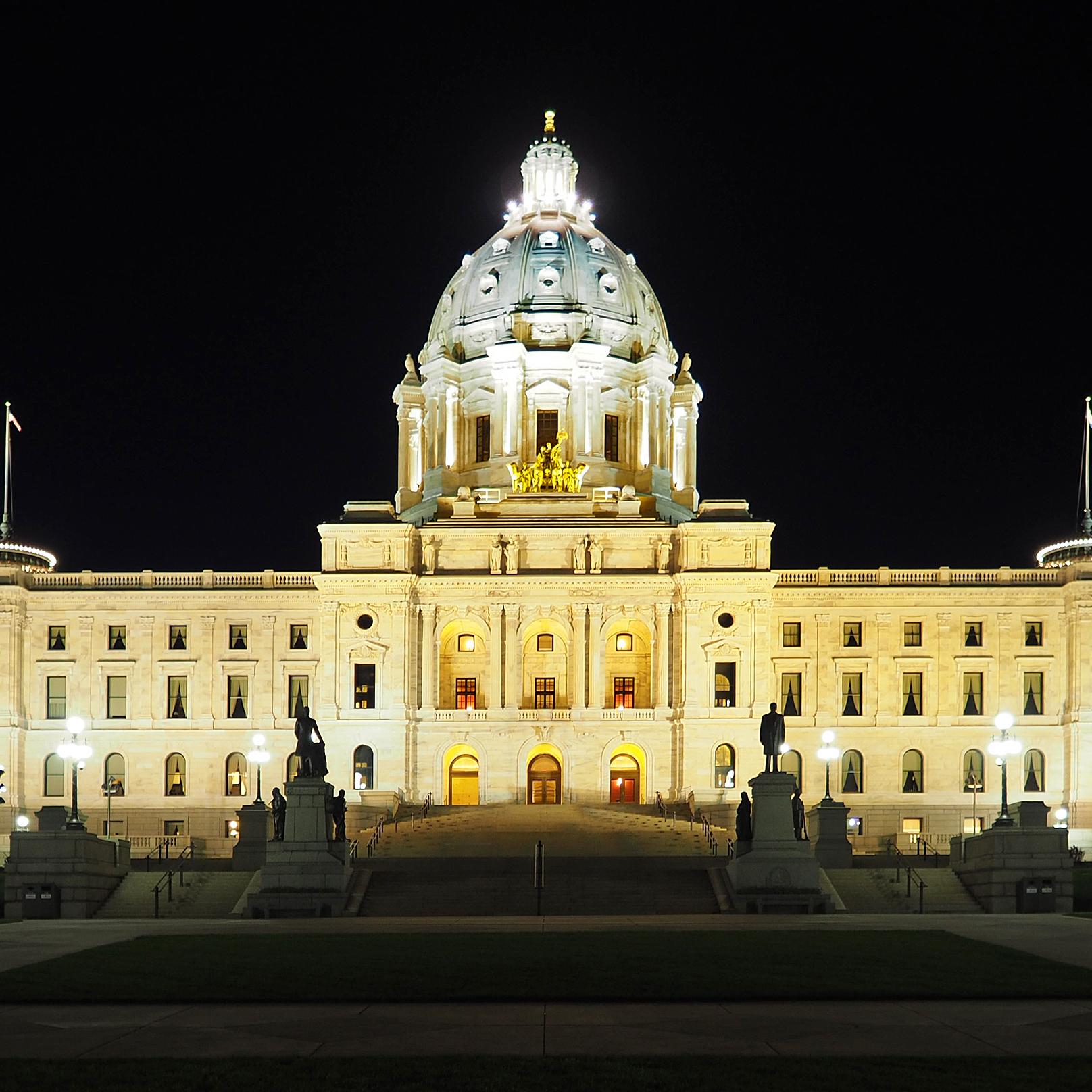 A photograph of the Minnesota State Capitol building taken at night.