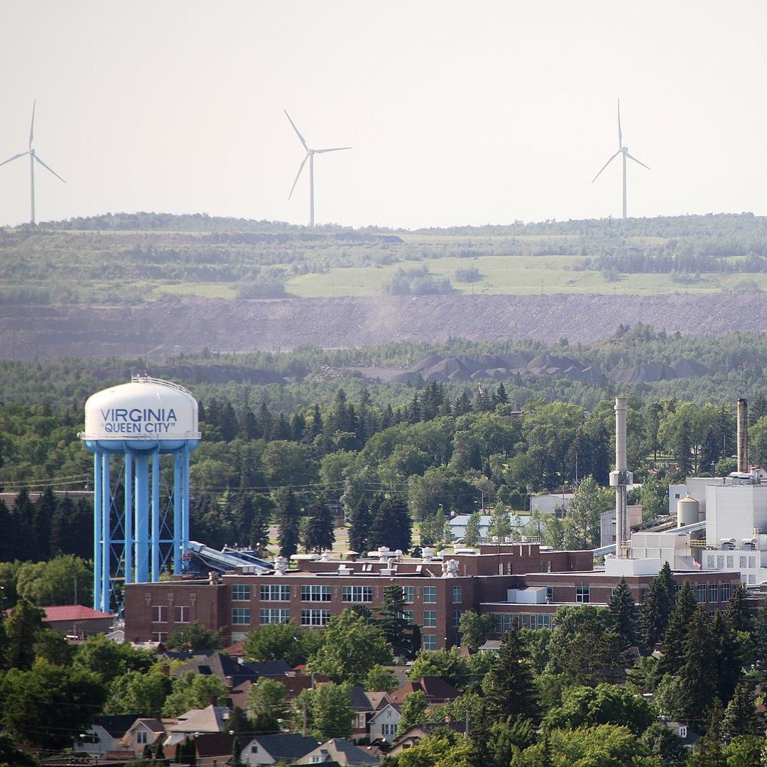 A photo of Virginia, Minnesota, showing a water tower and windmills in the distance.
