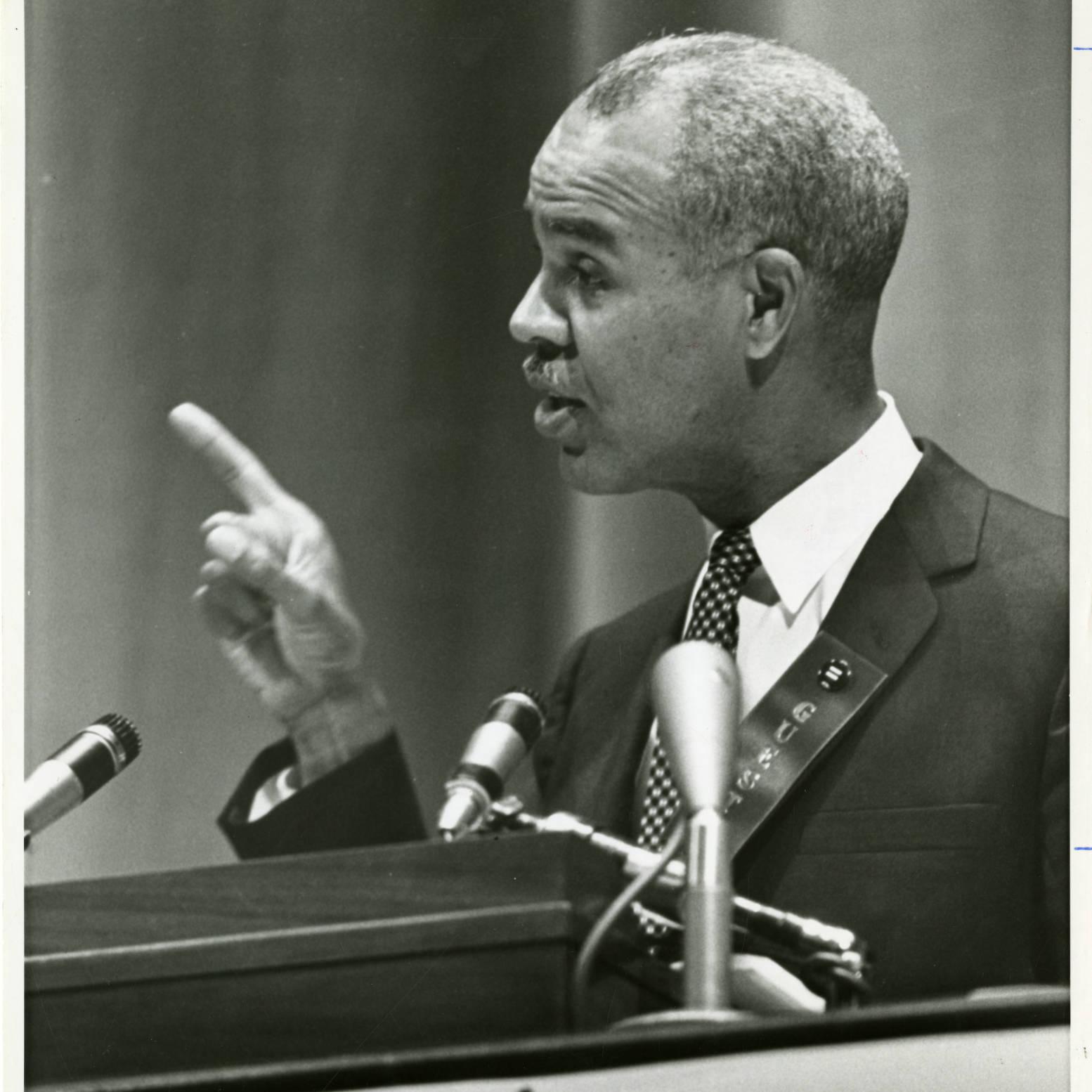 NAACP Director Roy Wilkins at a podium
